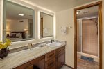 Single vanity, shower, bathtub combo off Suite 1